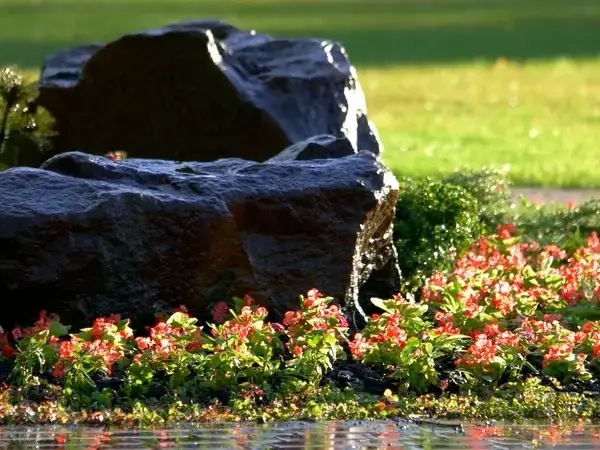 Adam Gorski Landscapes team installing patio during dry summer in Maple Valley